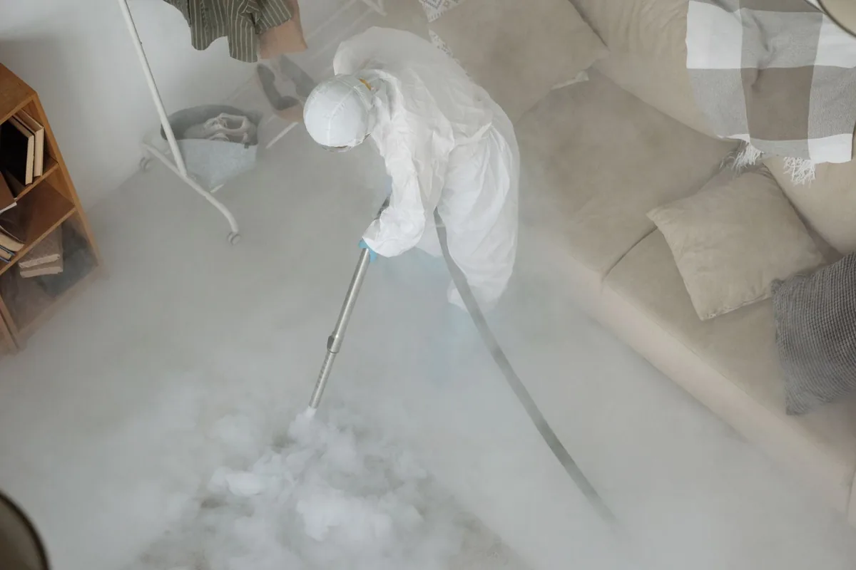Biohazard cleanup technician in protective equipment, Bennettsville, SC